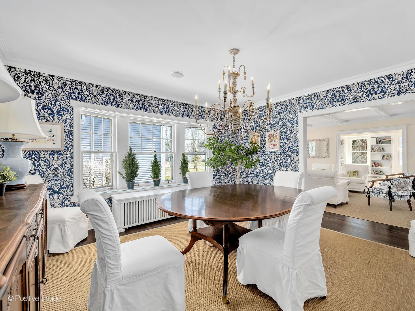 607 Willow Road Winnetka, IL 60093 - Photo 9 of 51 a dining room with furniture a chandelier and wooden floor
