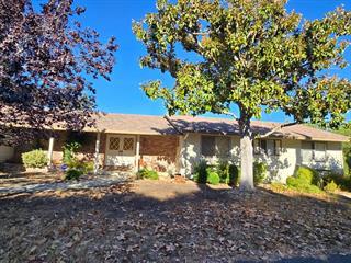12130 Foothill Lane Los Altos Hills, CA 94022 - Photo 1 of 13 a view of a patio with furniture and a large tree