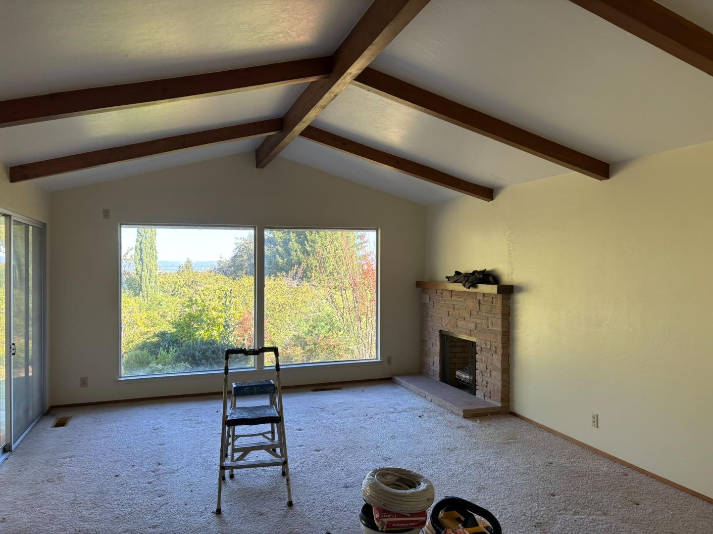 12130 Foothill Lane Los Altos Hills, CA 94022 - Photo 12 of 13 a living room with furniture and a fireplace