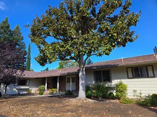12130 Foothill Lane Los Altos Hills, CA 94022 - Photo 2 of 13 a front view of a house with garden