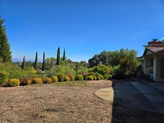 12130 Foothill Lane Los Altos Hills, CA 94022 - Photo 3 of 13 a view of a garden with a building in the background