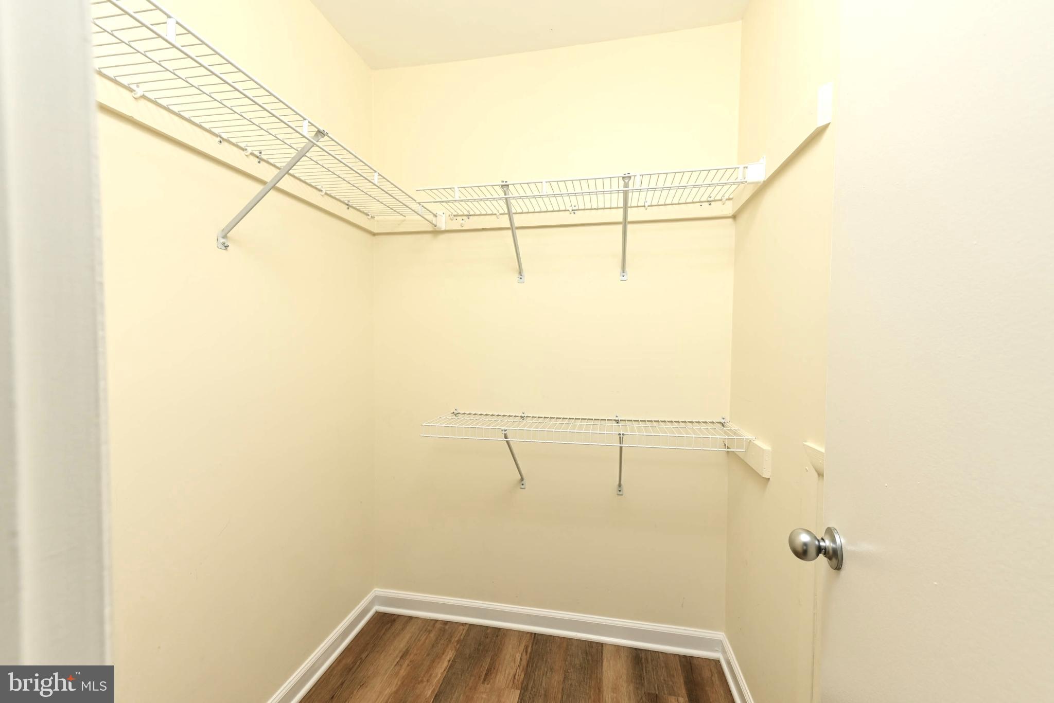 1706 Ascot Way, Unit B Reston, VA 20190 - Photo 13 of 14 a view of a room with racks on the wall