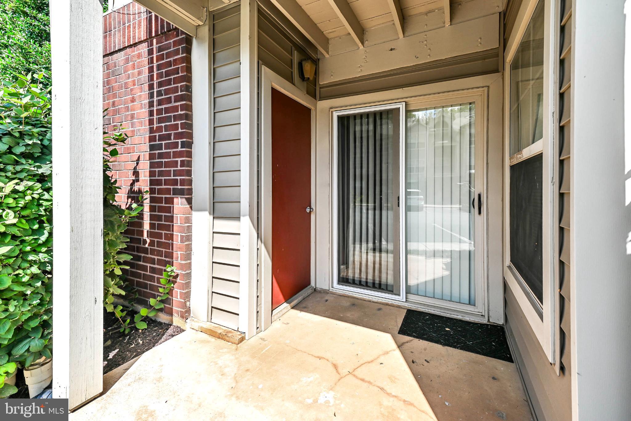 1706 Ascot Way, Unit B Reston, VA 20190 - Photo 14 of 14 a view of a front door and porch