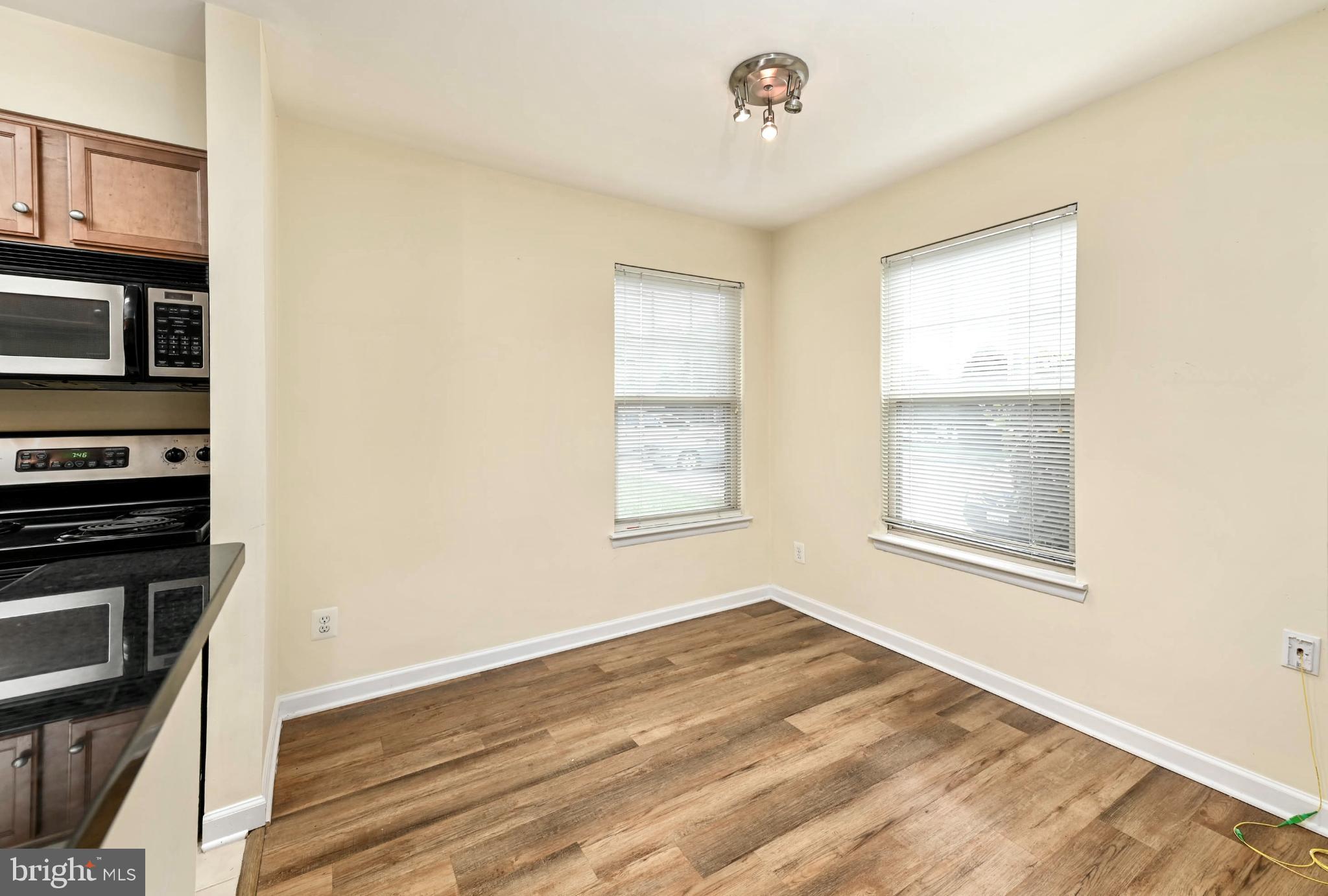 1706 Ascot Way, Unit B Reston, VA 20190 - Photo 5 of 14 a view of an empty room with a window
