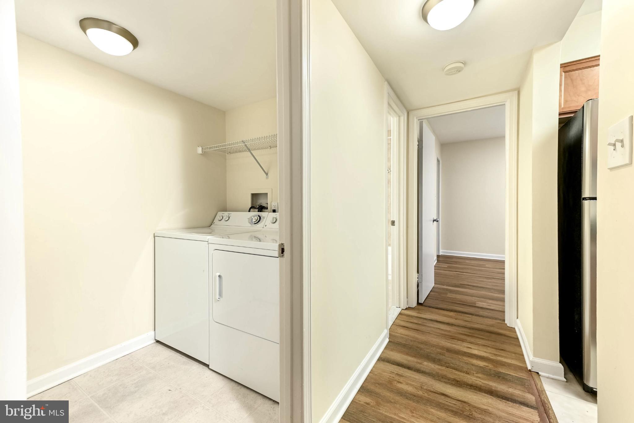 1706 Ascot Way, Unit B Reston, VA 20190 - Photo 8 of 14 a view of a hallway with wooden floor and closet