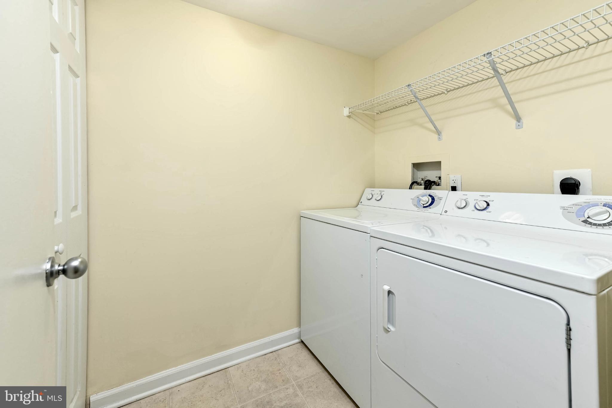 1706 Ascot Way, Unit B Reston, VA 20190 - Photo 9 of 14 a utility room with dryer and washer