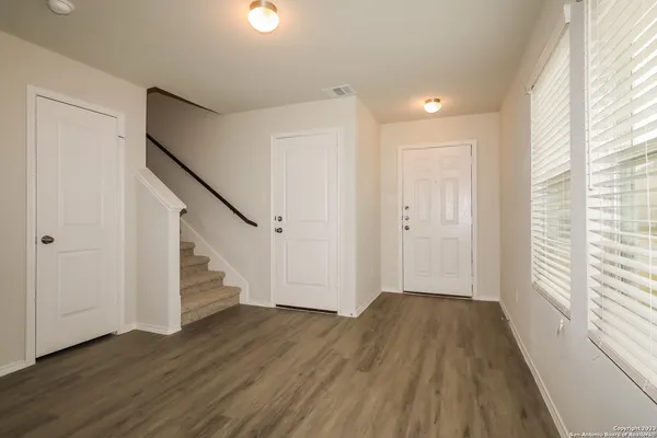 a view of entryway with wooden floor