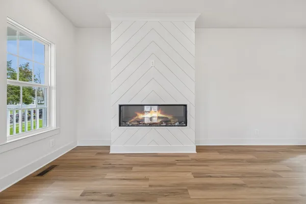 a view of entryway with wooden floor