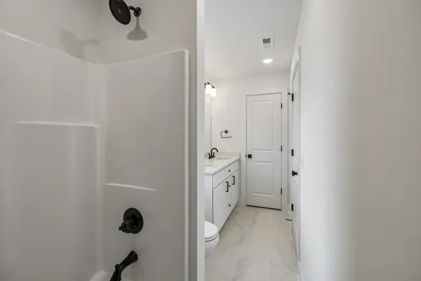 a view of an empty walk in closet