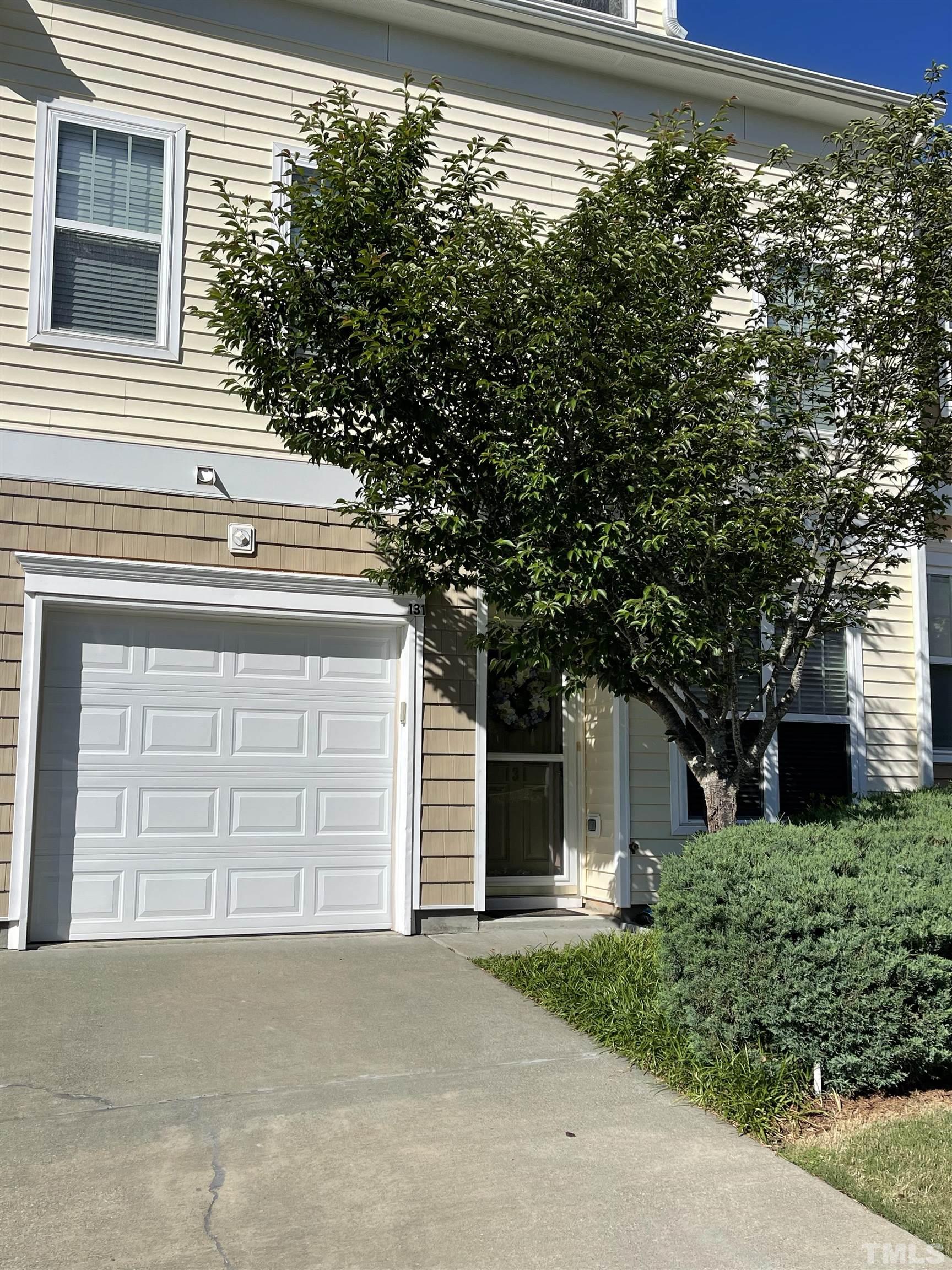 131 Deacon Ridge Street Wake Forest, NC 27587 - Photo 3 of 12 a front view of a house with a garage
