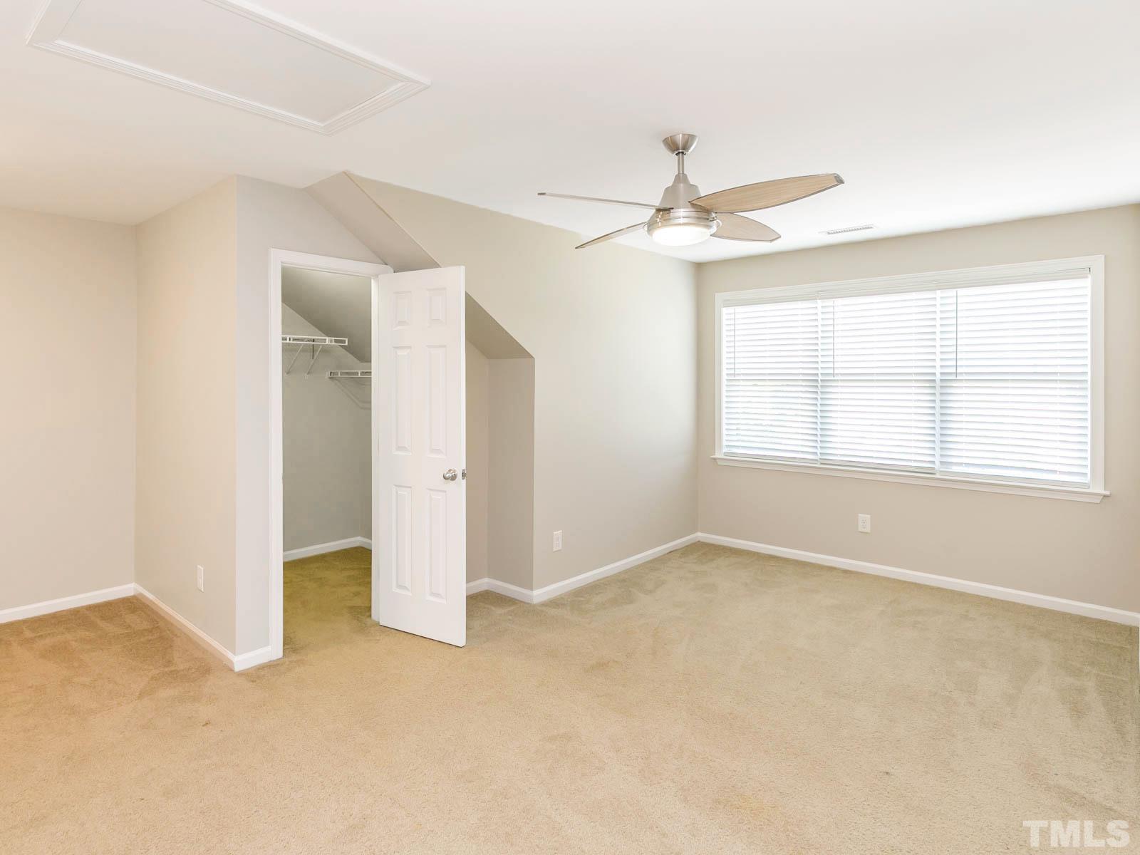 131 Deacon Ridge Street Wake Forest, NC 27587 - Photo 7 of 12 a view of an empty room with a window