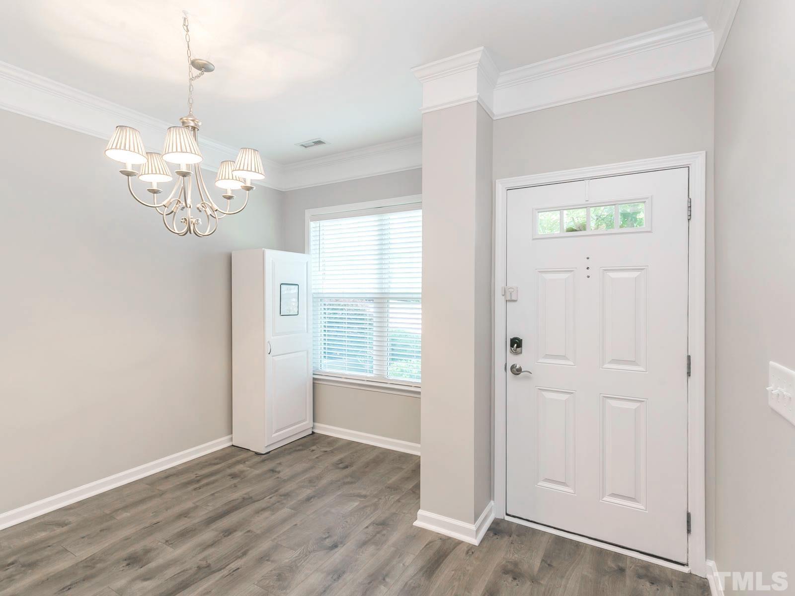 131 Deacon Ridge Street Wake Forest, NC 27587 - Photo 10 of 12 wooden floor in an empty room with a window