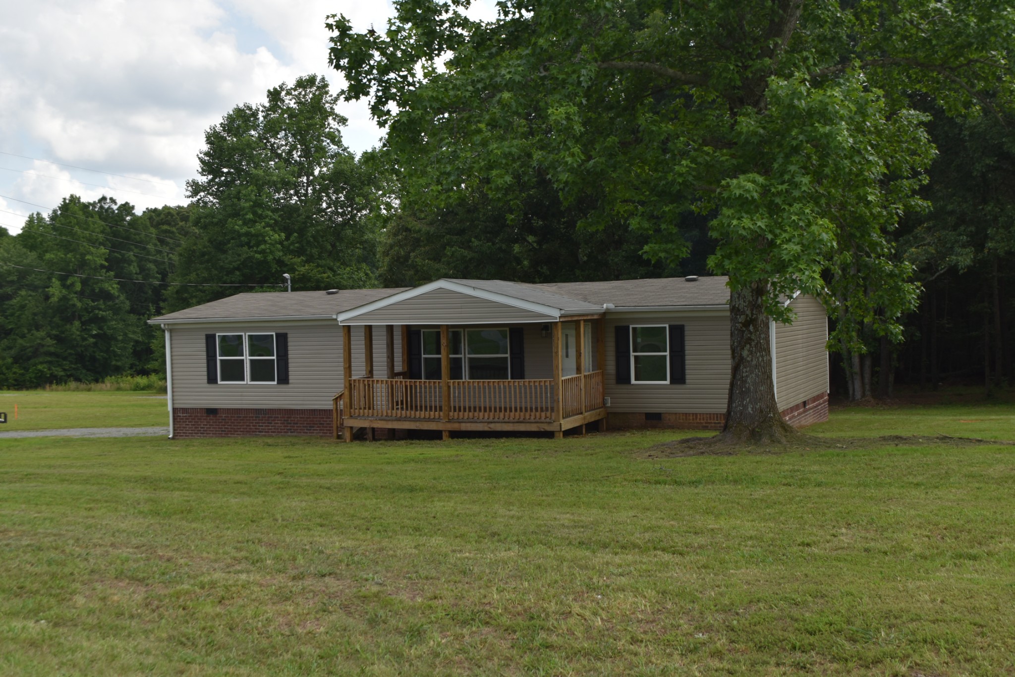 149 Harbin Road Fayetteville, TN 37334 - Photo 3 of 12 a front view of a house with a garden