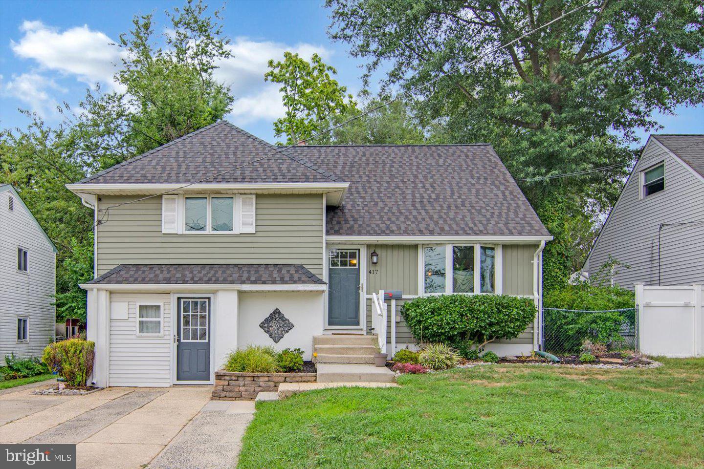 417 Dickinson Road Glassboro, NJ 08028 - Photo 1 of 36 a front view of a house with garden