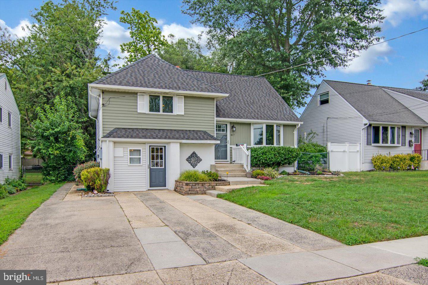 417 Dickinson Road Glassboro, NJ 08028 - Photo 2 of 36 a front view of a house with garden