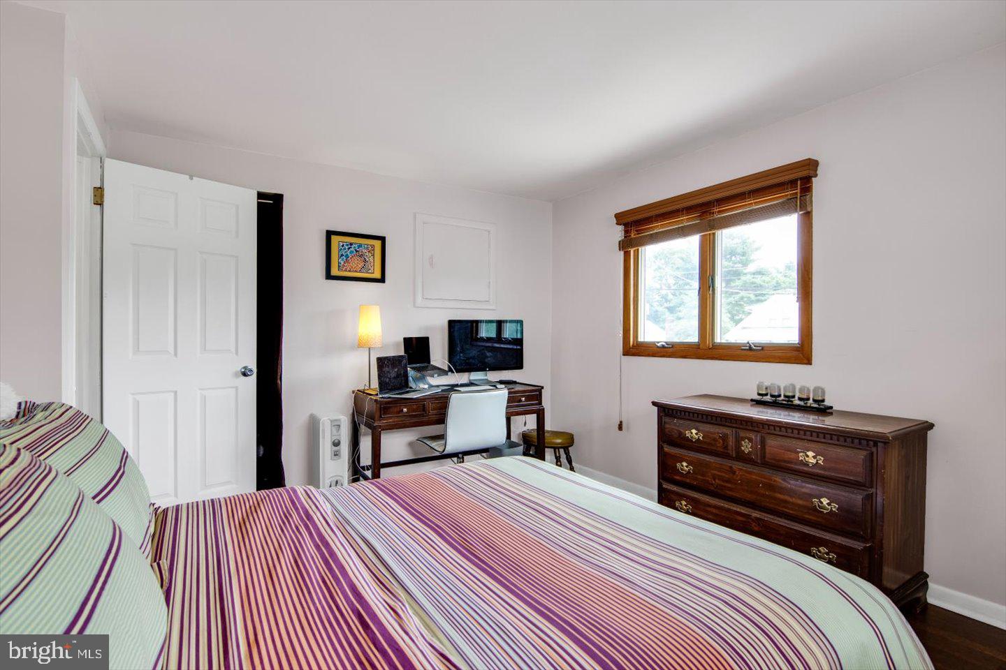 417 Dickinson Road Glassboro, NJ 08028 - Photo 15 of 36 a bedroom with a bed and a flat screen tv