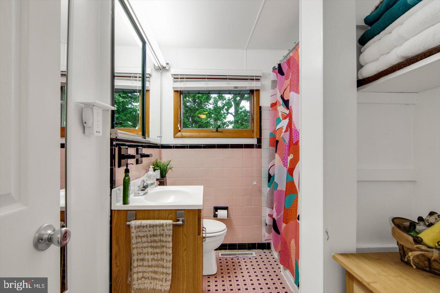 417 Dickinson Road Glassboro, NJ 08028 - Photo 18 of 36 a bathroom with a sink toilet and a window