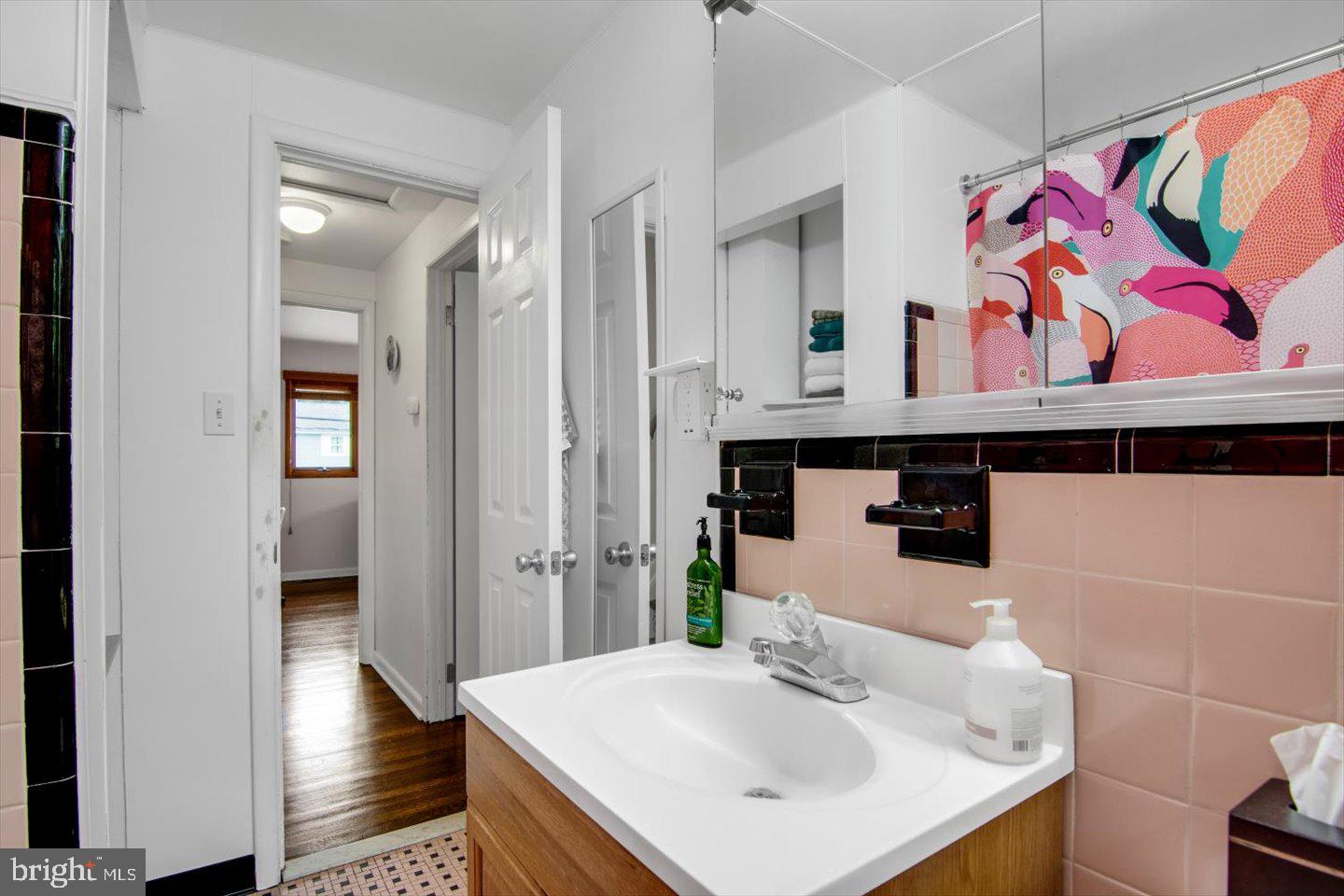 417 Dickinson Road Glassboro, NJ 08028 - Photo 19 of 36 a bathroom with a sink and a mirror