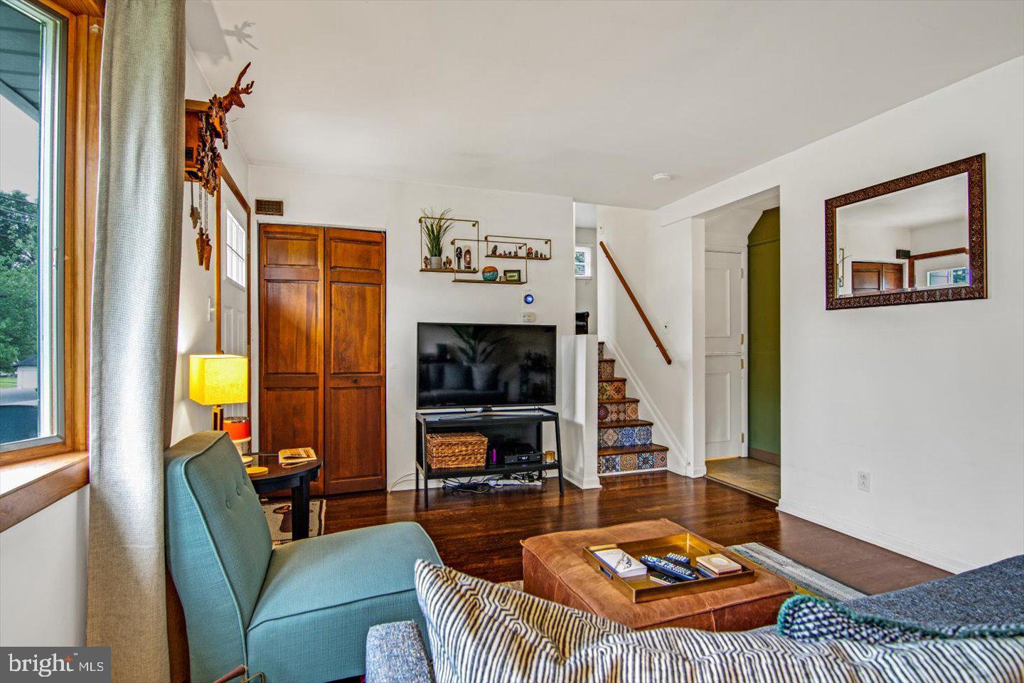 417 Dickinson Road Glassboro, NJ 08028 - Photo 7 of 36 a living room with furniture and a floor to ceiling window