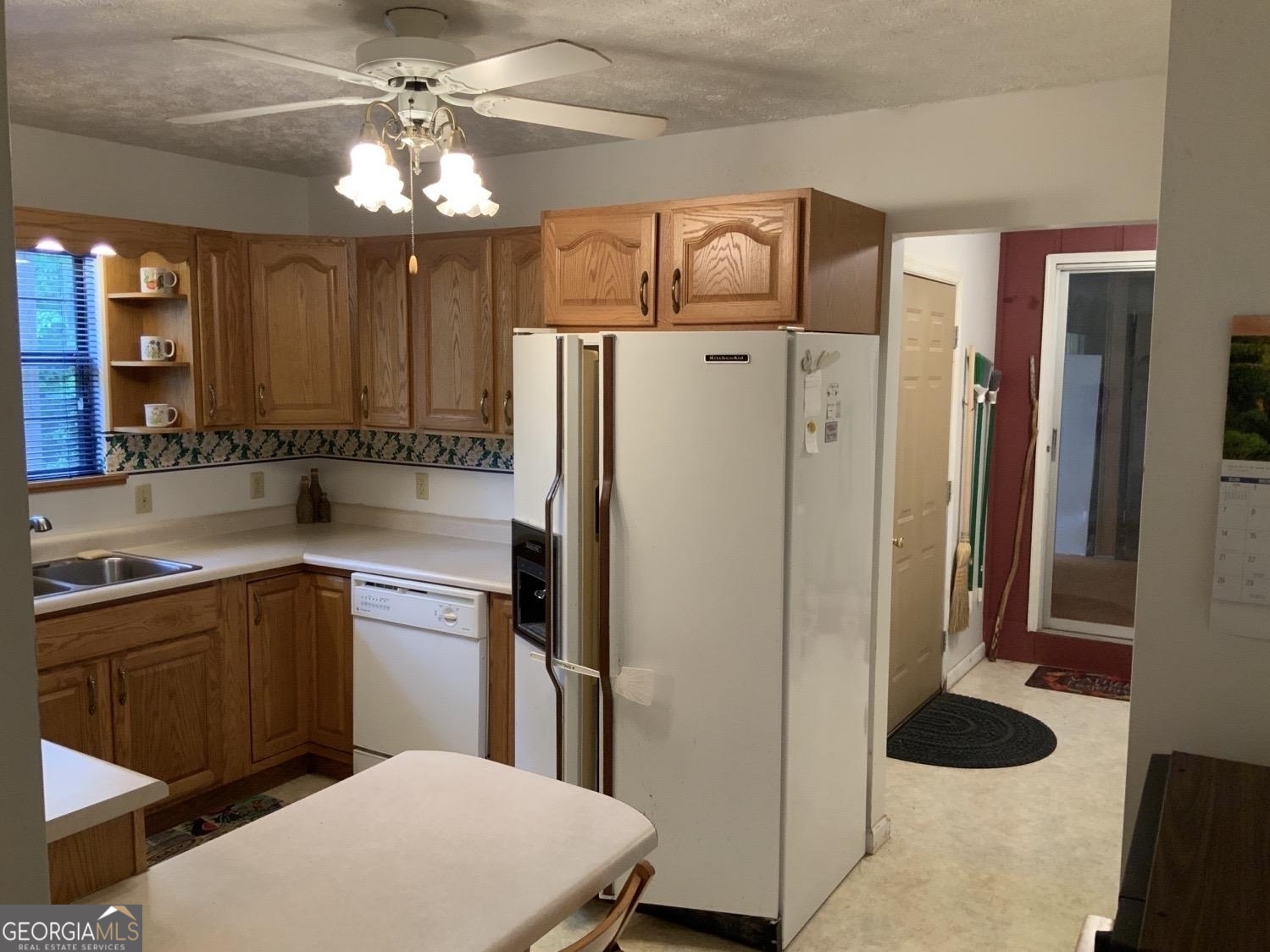 277 Hamilton Road Blairsville, GA 30512 - Photo 7 of 27 a kitchen with stainless steel appliances a refrigerator and a sink