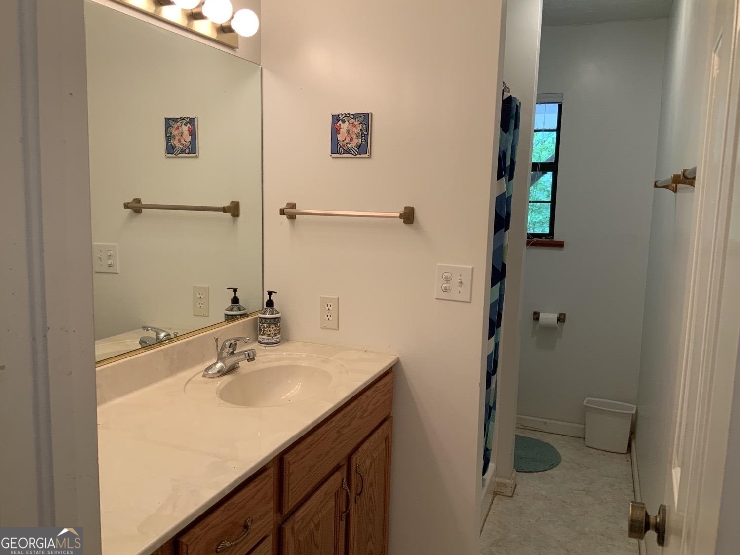 277 Hamilton Road Blairsville, GA 30512 - Photo 10 of 27 a bathroom with a sink and mirror
