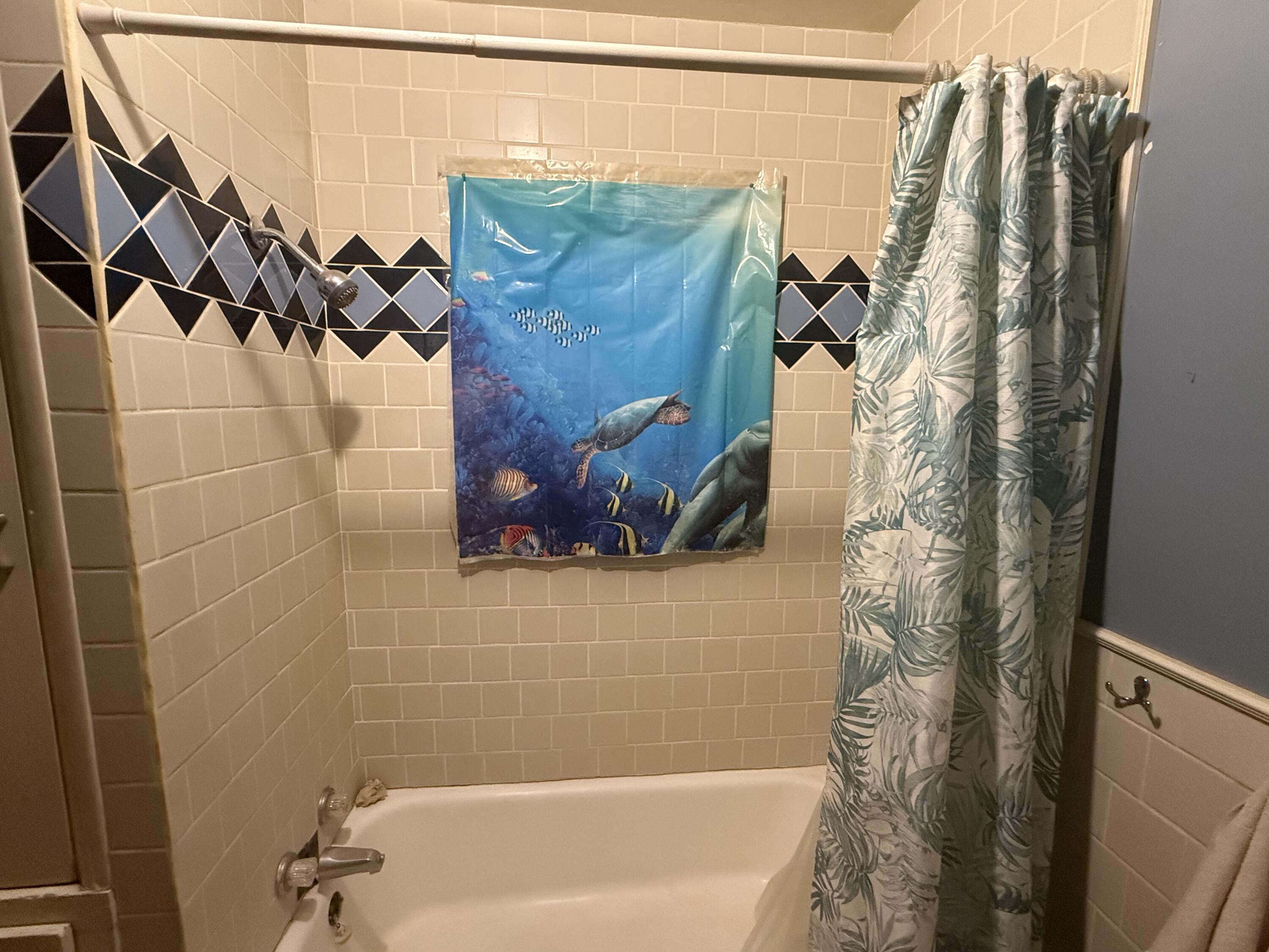 1211 Main Ralls, TX 79357 - Photo 7 of 9 a bathroom with a shower and a tub