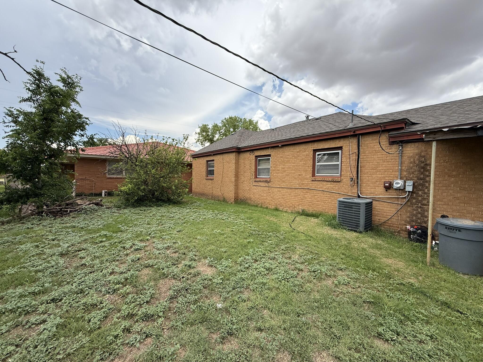 1211 Main Ralls, TX 79357 - Photo 8 of 9 a view of a backyard with a garden