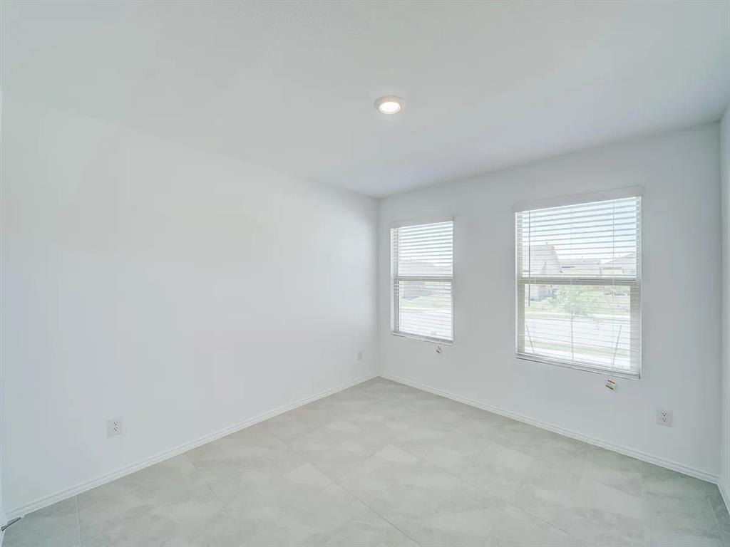 352 Sun Bluff Road Fort Worth, TX 76052 - Photo 15 of 33 Neutral interior featuring light gray tile flooring, recessed ceiling lighting, and two windows with blinds