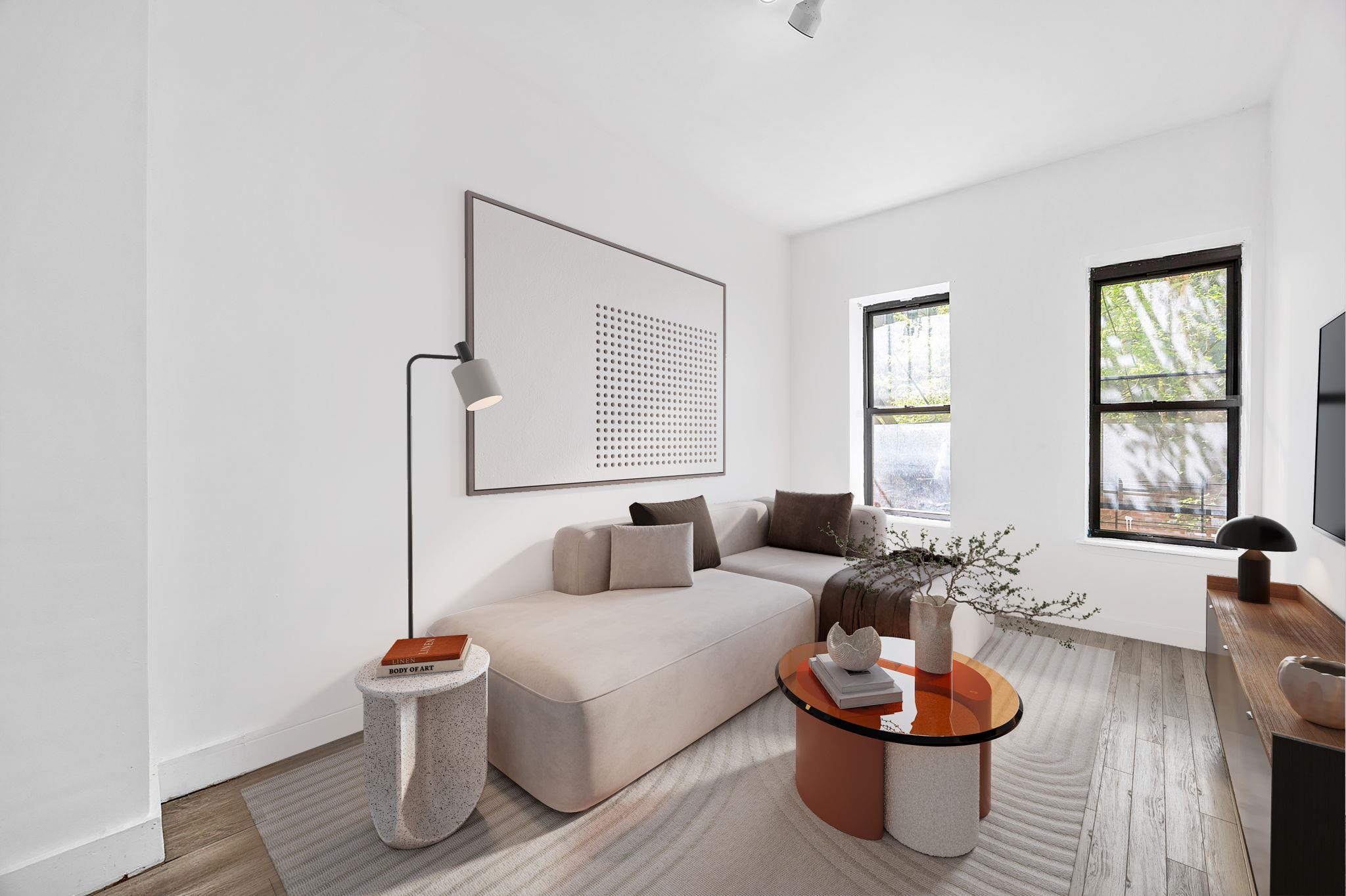 Living room with baseboards and wood finished floors