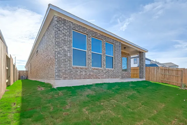 a backyard of a house with lots of green space