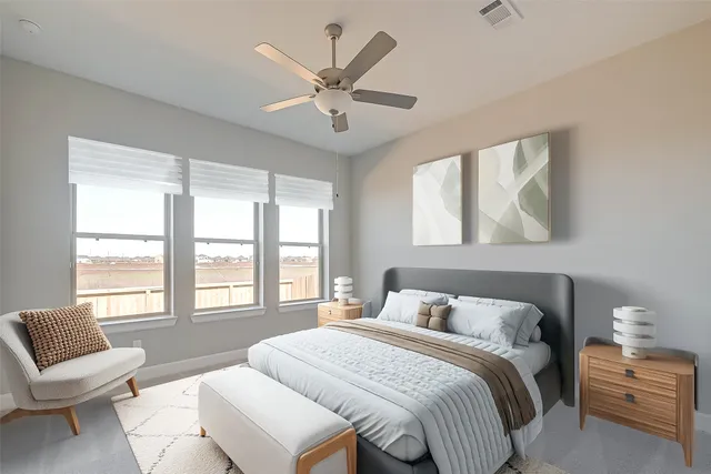 a bedroom with a bed and a large window