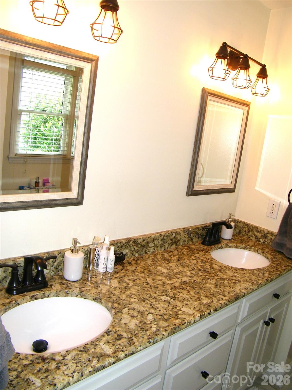 609 Redah Avenue Locust, NC 28097 - Photo 17 of 37 a bathroom with a granite countertop sink and a mirror