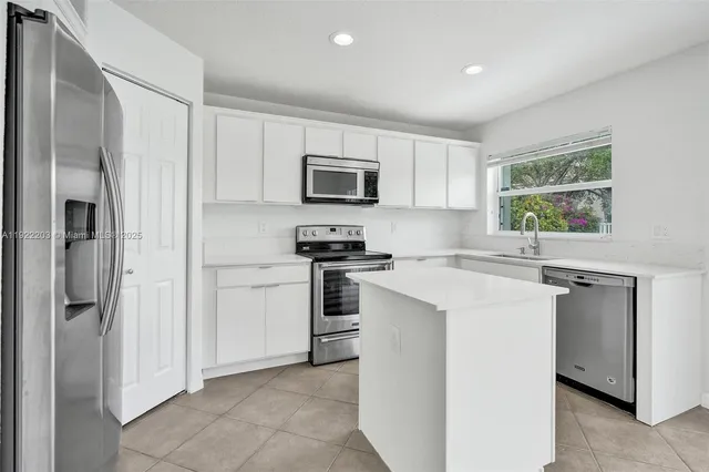 a view of a pathway of a house with a yard