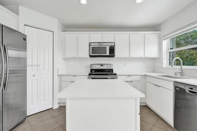 an aerial view of a house with a mountain