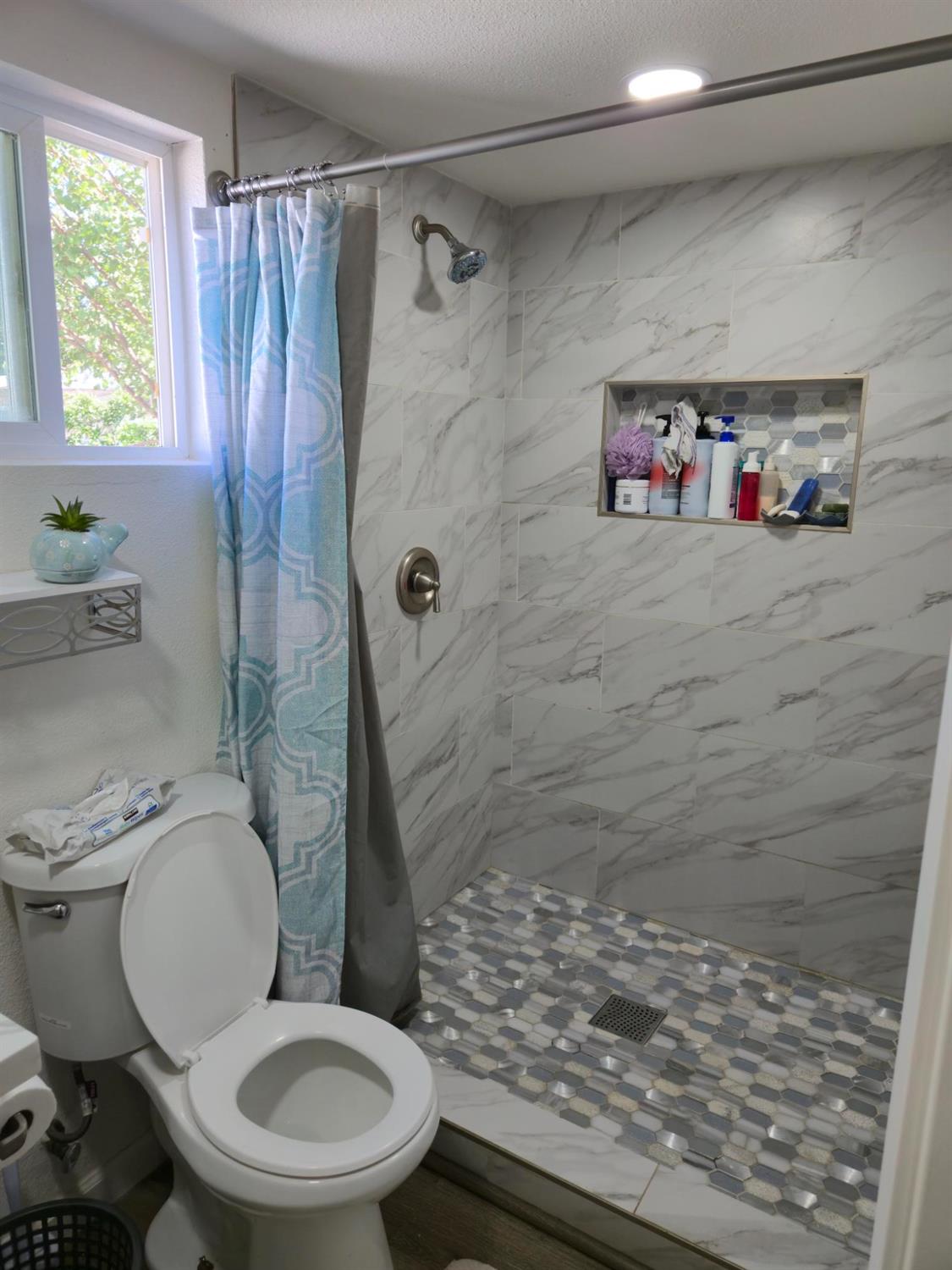 1284 Elizabeth Street, Unit 80 Coalinga, CA 93210 - Photo 13 of 24 a bathroom with a toilet and a shower