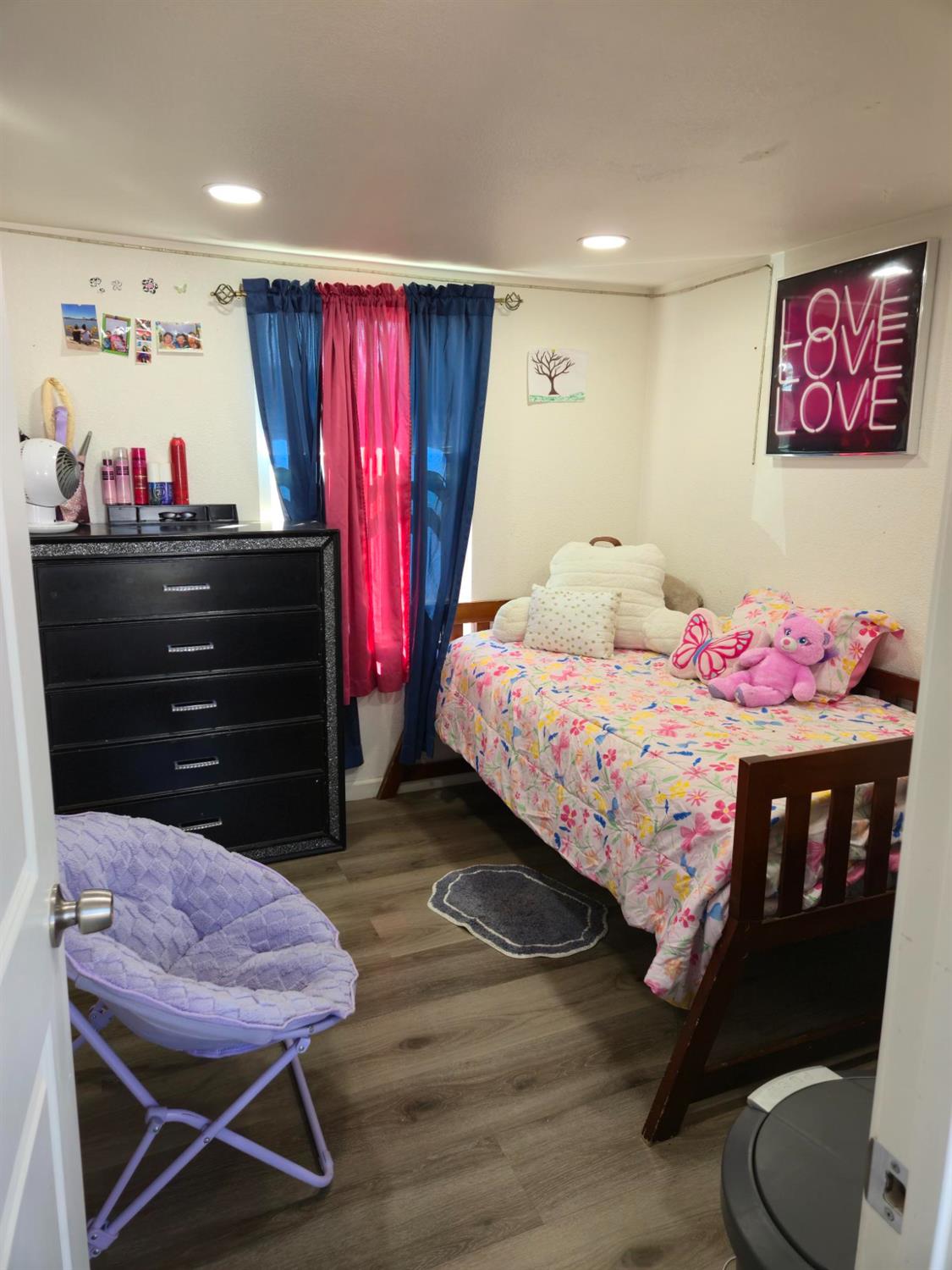 1284 Elizabeth Street, Unit 80 Coalinga, CA 93210 - Photo 19 of 24 a bedroom with a bed a desk and chair
