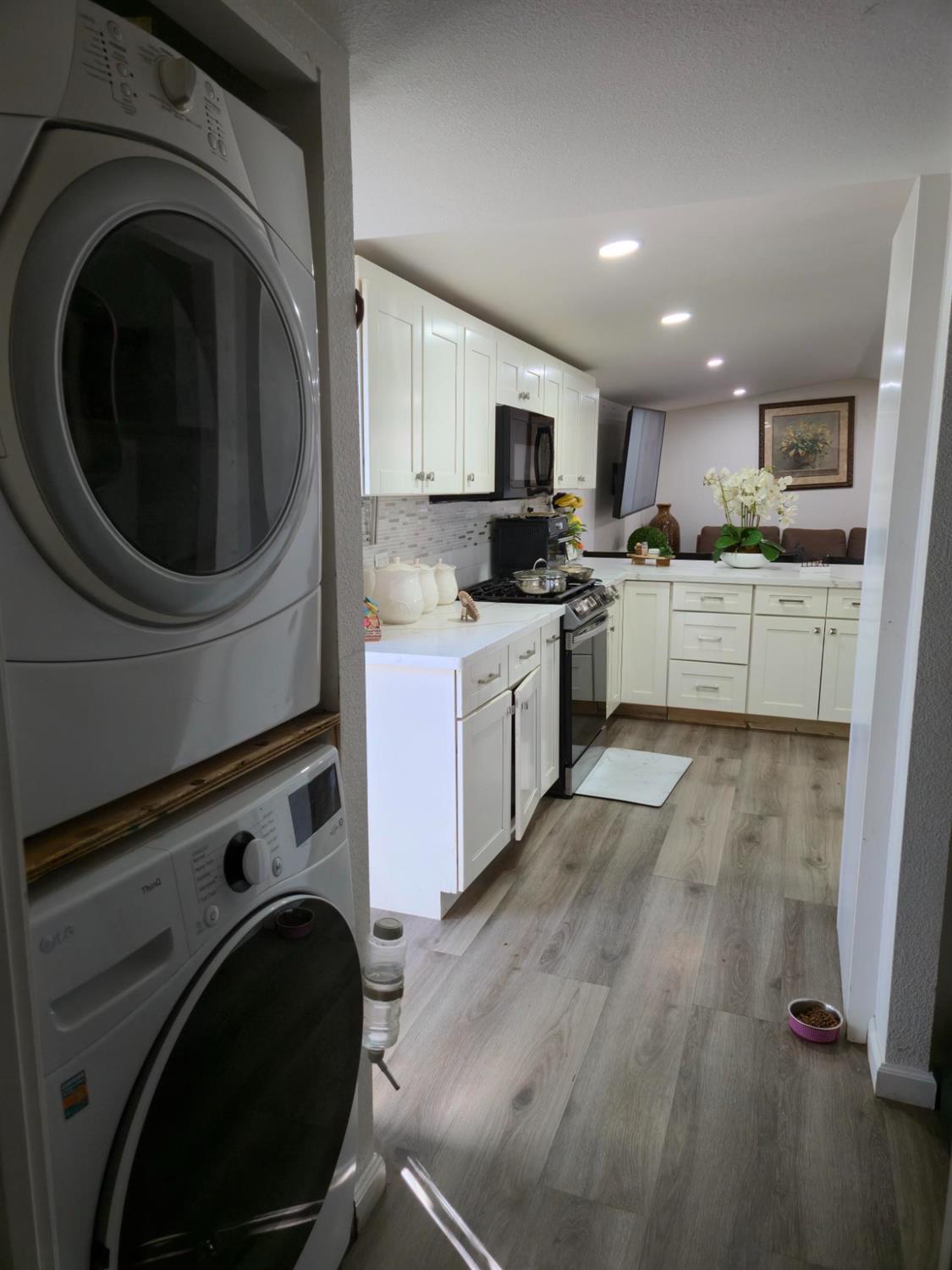 1284 Elizabeth Street, Unit 80 Coalinga, CA 93210 - Photo 10 of 24 a kitchen with kitchen island sink stove and cabinets