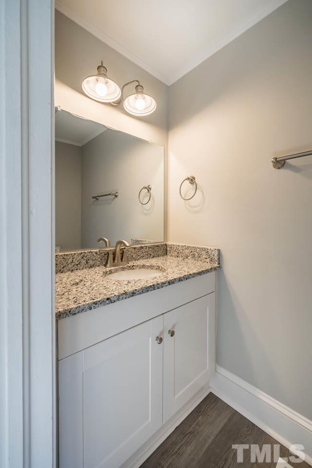 305 School House Road Efland, NC 27243 - Photo 13 of 35 a bathroom with a granite countertop sink and a mirror
