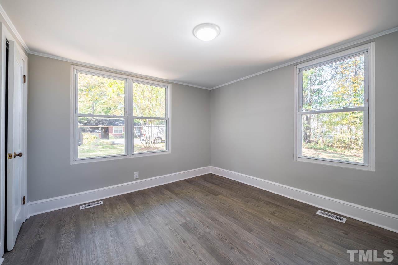 305 School House Road Efland, NC 27243 - Photo 16 of 35 a view of an empty room with wooden floor and a window