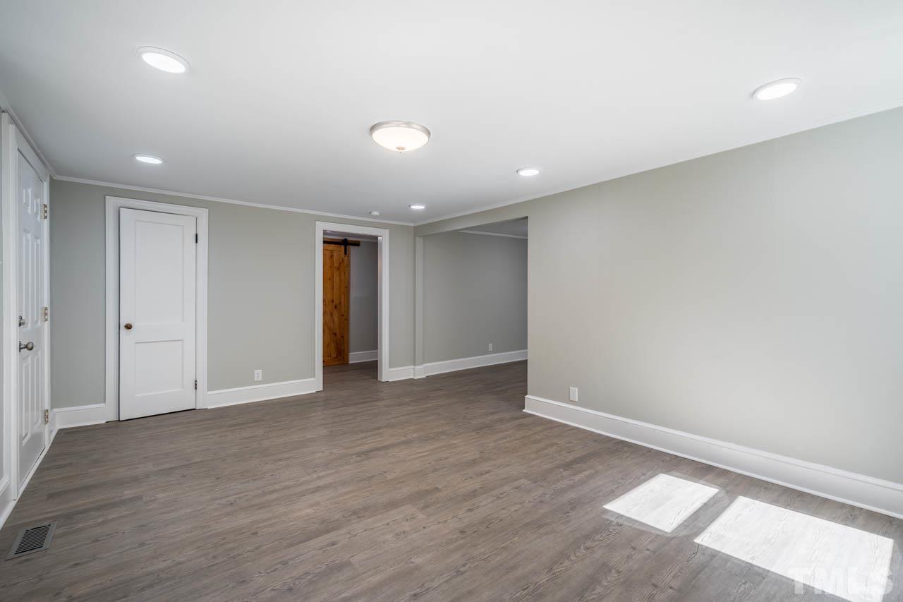 305 School House Road Efland, NC 27243 - Photo 18 of 35 a view of an empty room with wooden floor