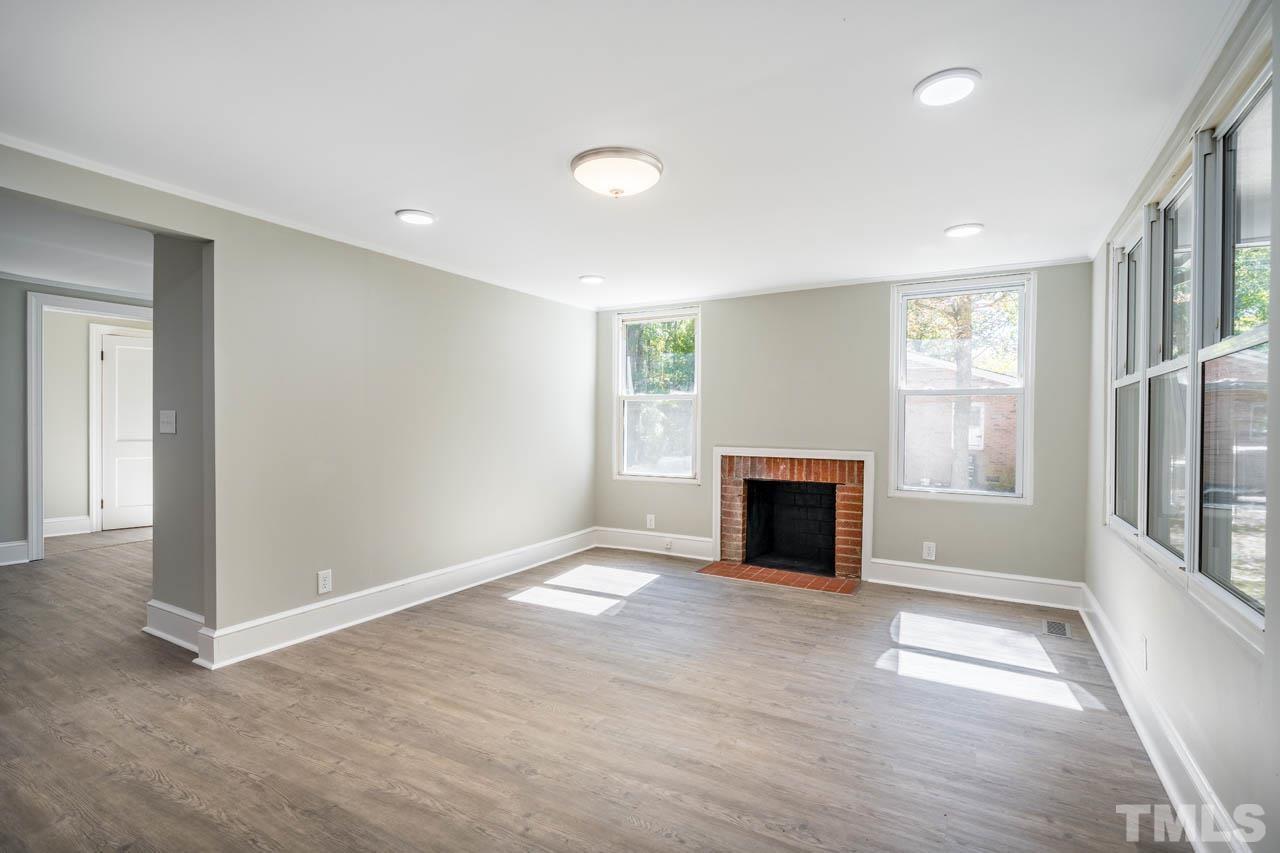 305 School House Road Efland, NC 27243 - Photo 20 of 35 an empty room with windows and fireplace
