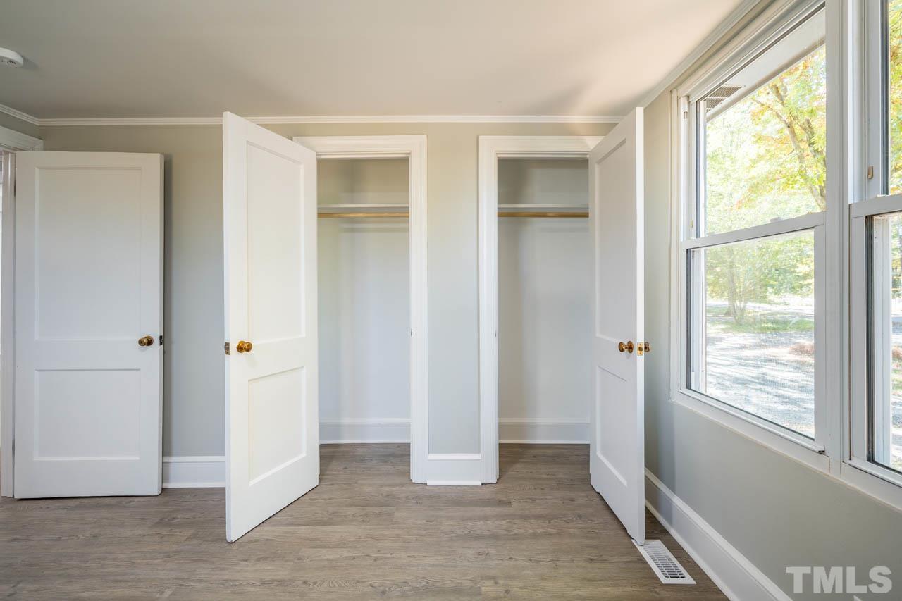 305 School House Road Efland, NC 27243 - Photo 24 of 35 a view of an empty room with wooden floor and a window