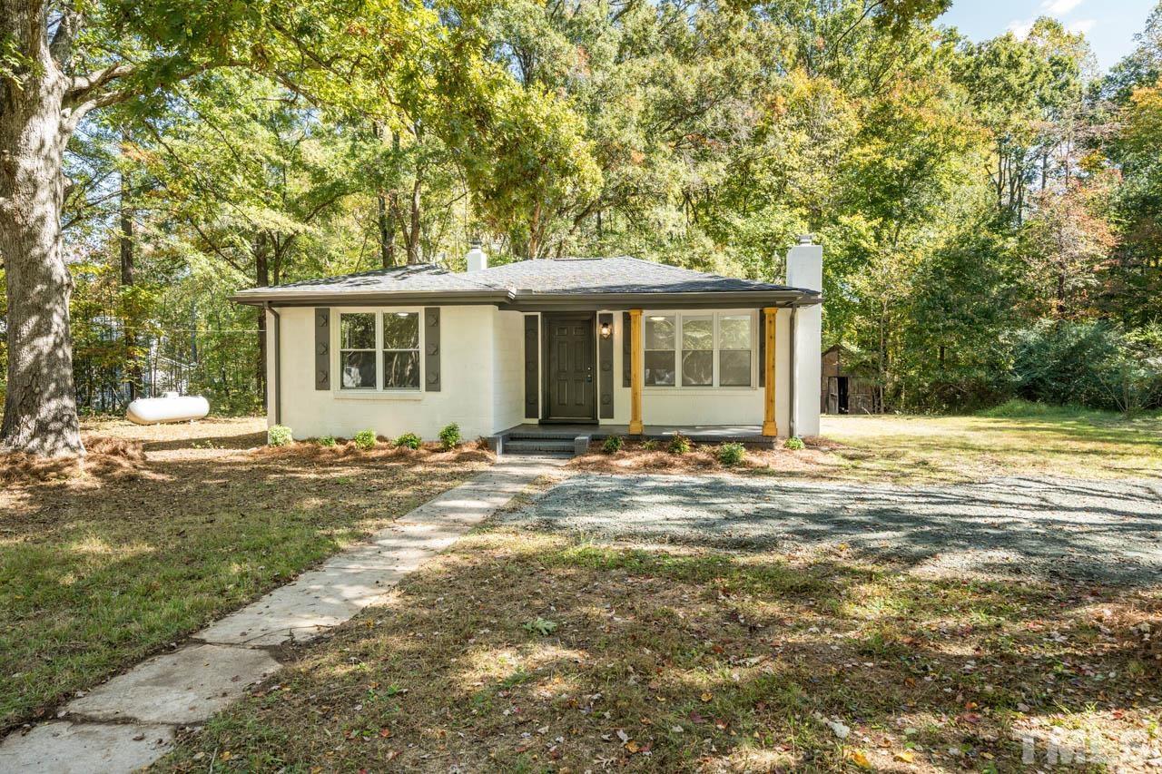 305 School House Road Efland, NC 27243 - Photo 5 of 35 front view of a house with a yard