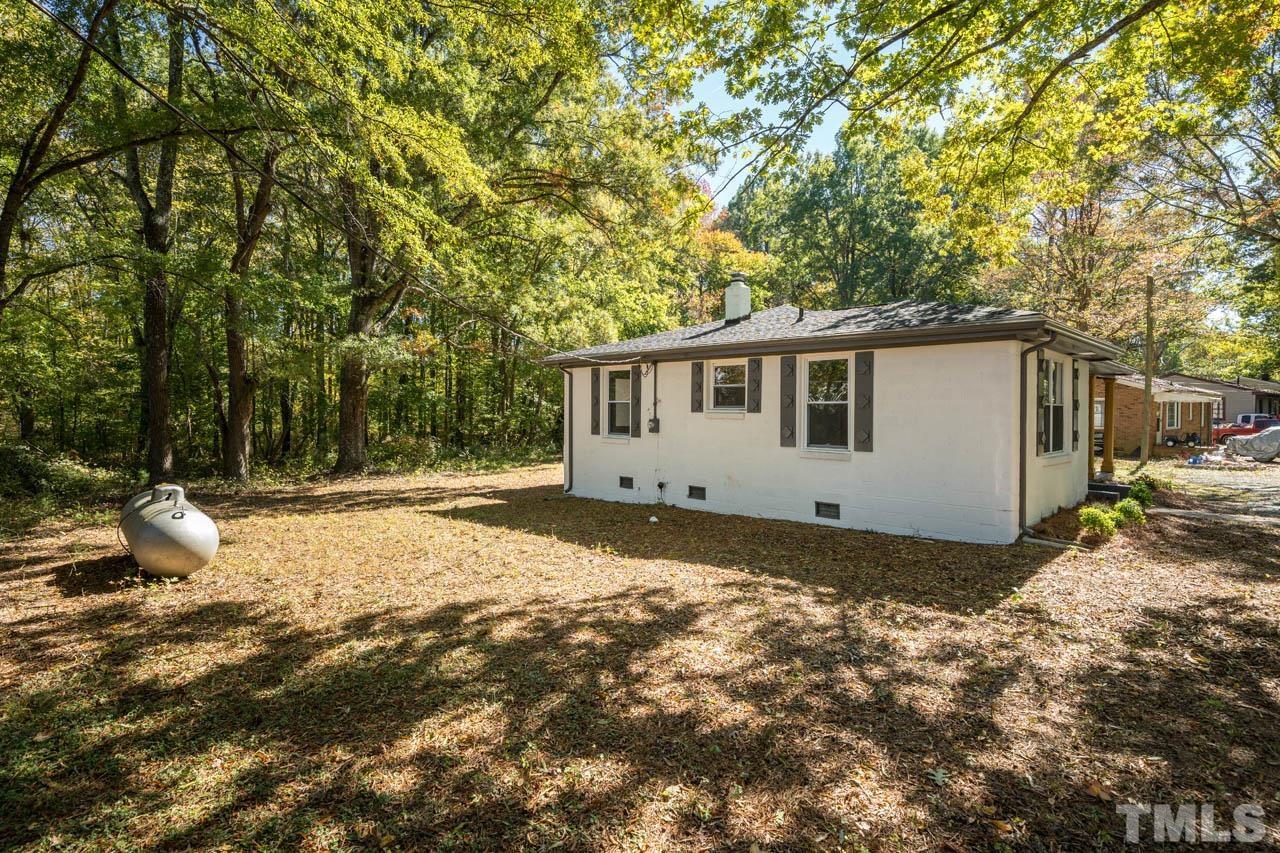 305 School House Road Efland, NC 27243 - Photo 7 of 35 a view of a house with backyard