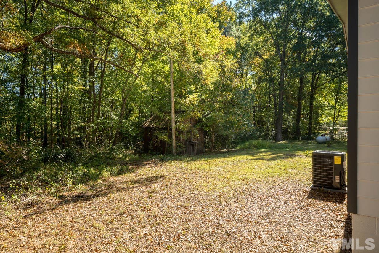 305 School House Road Efland, NC 27243 - Photo 8 of 35 a view of a yard with trees