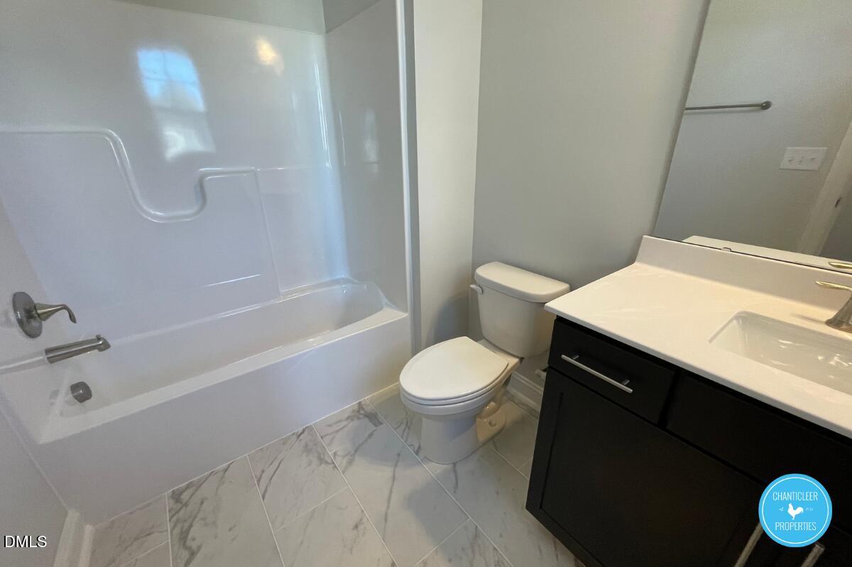 105 Chesapeake Way Chapel Hill, NC 27516 - Photo 18 of 26 a bathroom with a sink a toilet and a bathtub