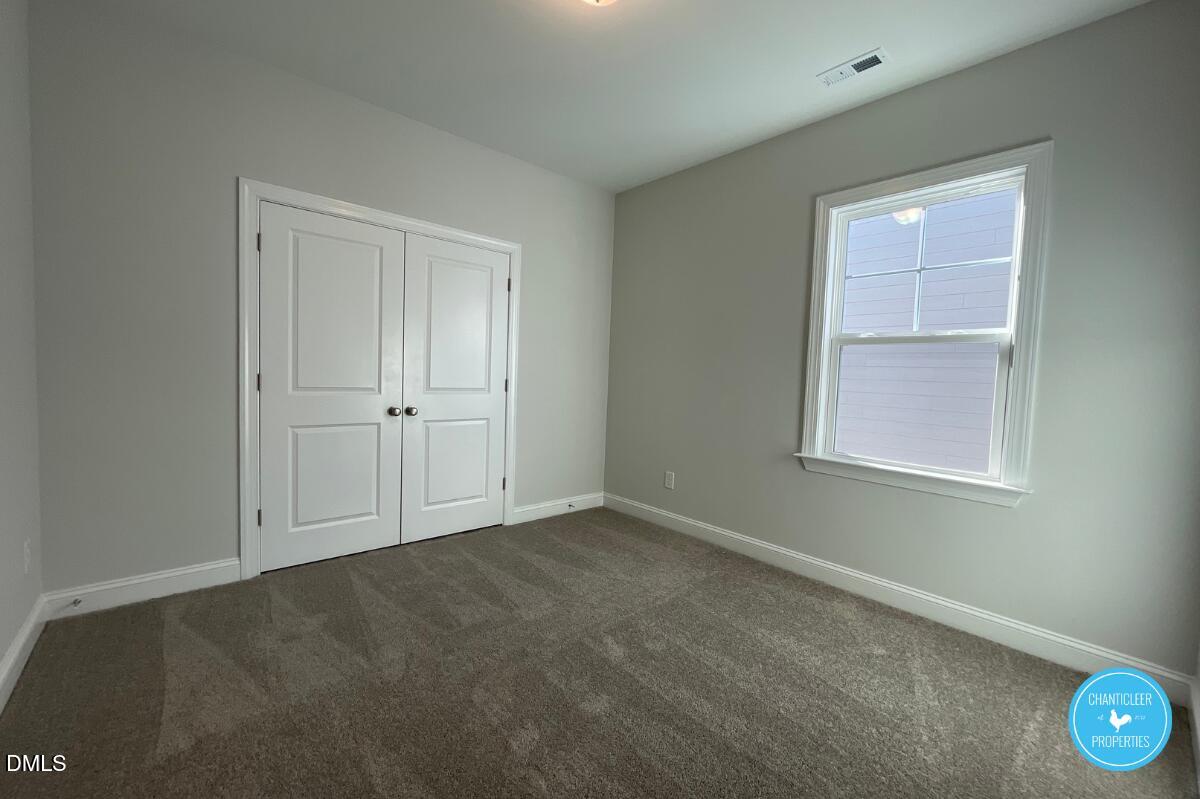 105 Chesapeake Way Chapel Hill, NC 27516 - Photo 19 of 26 an empty room with windows and closet