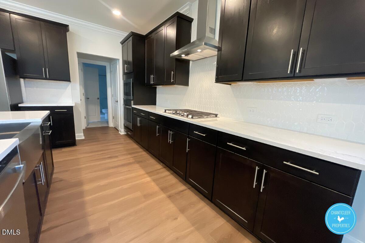 105 Chesapeake Way Chapel Hill, NC 27516 - Photo 5 of 26 a kitchen with stainless steel appliances a sink stove and refrigerator