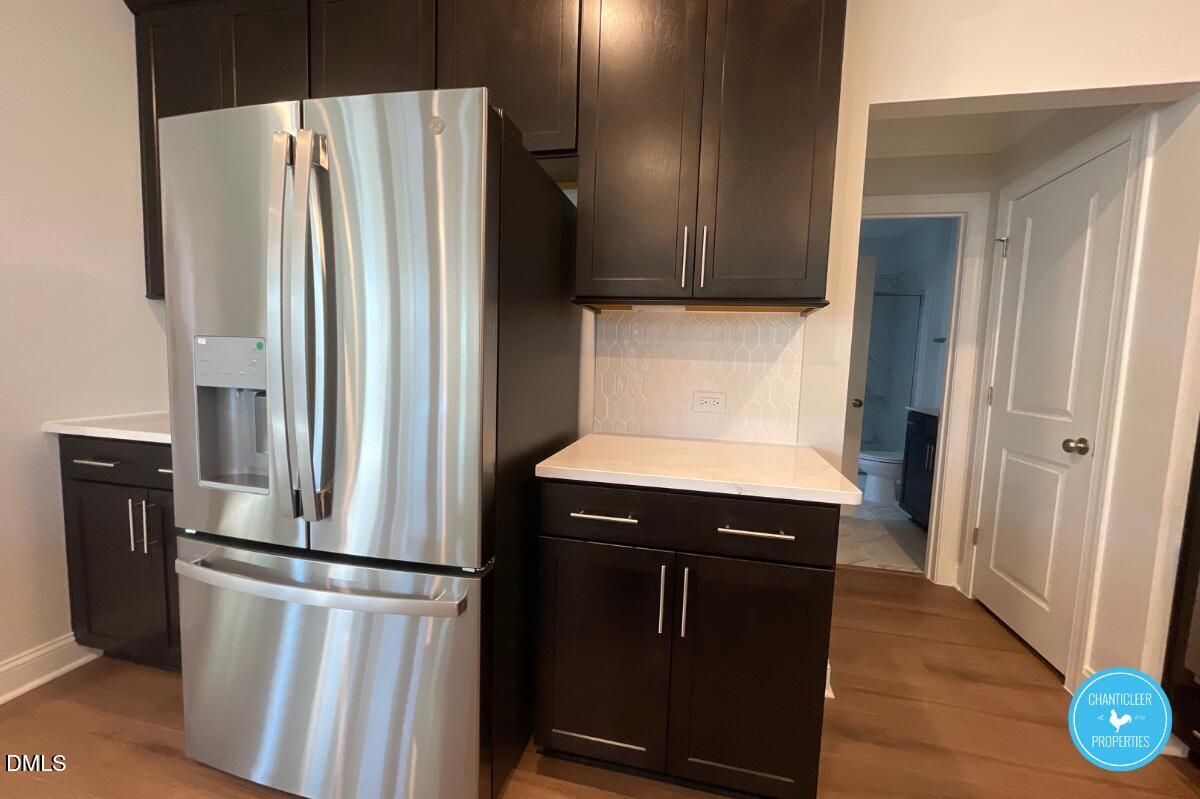 105 Chesapeake Way Chapel Hill, NC 27516 - Photo 6 of 26 a kitchen with metallic refrigerator and washer