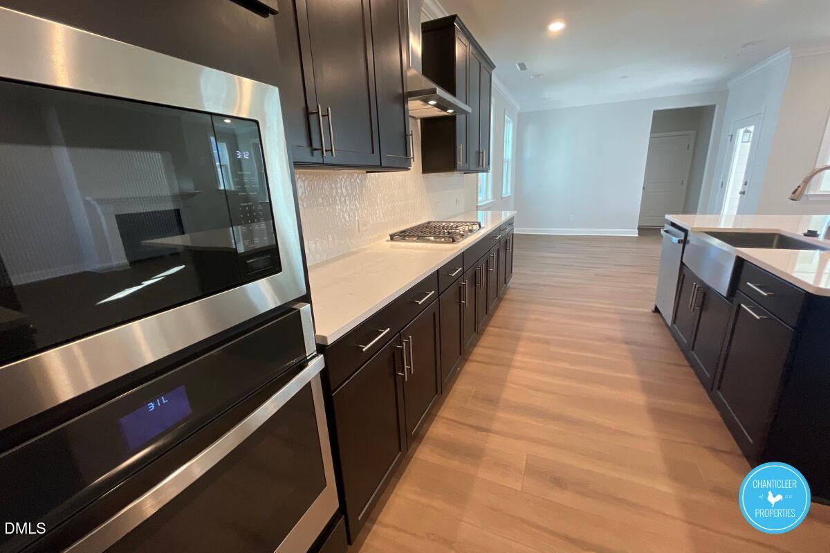 105 Chesapeake Way Chapel Hill, NC 27516 - Photo 7 of 26 a bathroom with a sink and a large mirror